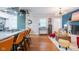 Open living space features an eat in kitchen, and a living room with a fireplace at 3312 W 42Nd St, Indianapolis, IN 46228