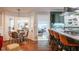 Open floorplan featuring kitchen with breakfast bar and dining area at 3312 W 42Nd St, Indianapolis, IN 46228