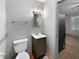 A bathroom with a toilet, vanity and wood look floors at 3344 Southwest Dr, Indianapolis, IN 46241