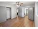 Bedroom featuring a ceiling fan, closet, and view into the bathroom at 3344 Southwest Dr, Indianapolis, IN 46241