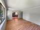 Living room featuring laminate floors and a view to the kitchen and backyard at 3344 Southwest Dr, Indianapolis, IN 46241