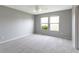 The primary bedroom includes two windows, carpet and ceiling fan at 3423 Summer Breeze Cir, Indianapolis, IN 46239