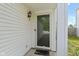 The front door is a classic style with glass and a screen with vinyl siding and exterior lighting at 3423 Summer Breeze Cir, Indianapolis, IN 46239