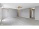 Spacious living room with neutral carpet and paint, and multiple entry points to other rooms at 3423 Summer Breeze Cir, Indianapolis, IN 46239
