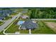 Aerial view of a community pool, clubhouse, bocce ball court, and pond with fountain at 3613 Lehigh Ave, Westfield, IN 46074