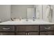 Bathroom vanity with a white countertop, a mirror, and storage cabinets underneath at 3613 Lehigh Ave, Westfield, IN 46074