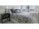 Comfortable bedroom featuring plush bedding, natural light from the windows, and a bedside table with lamp at 3613 Lehigh Ave, Westfield, IN 46074