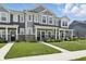 Desirable townhome showcasing a well-manicured lawn and inviting covered front porch at 3613 Lehigh Ave, Westfield, IN 46074