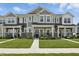 Charming townhome featuring stone accents, well-maintained lawn, and covered front porch at 3613 Lehigh Ave, Westfield, IN 46074
