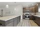 This kitchen boasts stainless steel appliances, modern cabinetry, and wood grain flooring at 3613 Lehigh Ave, Westfield, IN 46074