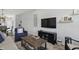 Well-lit living room showcasing an entertainment center, wall decor, and comfortable seating at 3613 Lehigh Ave, Westfield, IN 46074