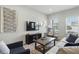 Cozy living room featuring neutral color palette, wall-mounted TV, and comfortable furnishings at 3613 Lehigh Ave, Westfield, IN 46074