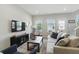 Bright living room with lots of windows and modern furnishings including a comfortable sofa and arm chairs at 3613 Lehigh Ave, Westfield, IN 46074