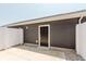 Home featuring backyard with a neutral wall and a black door and concrete walkway at 3643 Thomas Jefferson St, Westfield, IN 46074