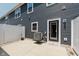 Exterior rear with access door and small patio area, air conditioning unit and privacy fence at 3643 Thomas Jefferson St, Westfield, IN 46074