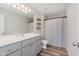 Full bathroom with a vanity, toilet, shower with a curtain, and wooden shelves at 3643 Thomas Jefferson St, Westfield, IN 46074