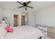 Bedroom with a ceiling fan, storage unit, and a view of an adjoining doorway at 3643 Thomas Jefferson St, Westfield, IN 46074
