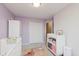 This is a bedroom with lavender walls, carpet flooring and a white crib at 3643 Thomas Jefferson St, Westfield, IN 46074