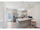 Bright, modern kitchen with gray cabinets, stainless steel appliances, and an island with seating at 3643 Thomas Jefferson St, Westfield, IN 46074