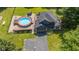 Aerial view of home featuring a fenced-in backyard, a pool, a deck, and a garage at 3715 Pitkin Rd, Martinsville, IN 46151