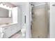 Clean bathroom with white vanity, shower with glass door, and pink accents at 3715 Pitkin Rd, Martinsville, IN 46151