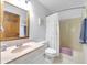Traditional bathroom with a peach colored vanity and tub/shower combination with a white shower curtain at 3715 Pitkin Rd, Martinsville, IN 46151