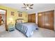 Cozy bedroom with dual closets, neutral walls, and a ceiling fan at 3715 Pitkin Rd, Martinsville, IN 46151