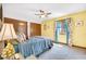 Bright bedroom with yellow walls, a ceiling fan, and a window with sheer curtains at 3715 Pitkin Rd, Martinsville, IN 46151
