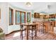 Eat-in dining area offers ample natural light and connects to a kitchen with wood cabinetry at 3715 Pitkin Rd, Martinsville, IN 46151