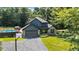Exterior home elevation with a driveway and front yard, with mature shade trees at 3715 Pitkin Rd, Martinsville, IN 46151