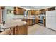 Well-equipped kitchen with stainless steel appliances and wooden cabinets, perfect for cooking at 3715 Pitkin Rd, Martinsville, IN 46151