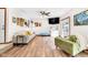 Bright living room features wood floors, modern furniture, and access to the outdoor deck at 3715 Pitkin Rd, Martinsville, IN 46151