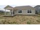 Back of home featuring a covered porch and a yard ready for landscaping at 3824 Dutton Dr, Bargersville, IN 46106