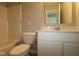 Bathroom featuring a single vanity, mirror, and a toilet next to a shower-tub combo at 3824 Dutton Dr, Bargersville, IN 46106