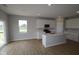 This kitchen features white cabinetry, quartz countertops, and stainless steel appliances and a large sliding glass door at 3824 Dutton Dr, Bargersville, IN 46106