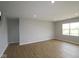 Spacious living room features vinyl flooring, recessed lighting and neutral paint with a large window providing plenty of natural light at 3824 Dutton Dr, Bargersville, IN 46106