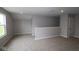 Spacious loft area with neutral colored walls and carpeting, perfect for a playroom or home office at 3824 Dutton Dr, Bargersville, IN 46106