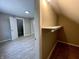 This attic closet features a finished wall and shelf at 3835 N Kenwood Ave, Indianapolis, IN 46208
