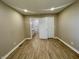 Bright bedroom with hardwood floors and access to a modern, updated bathroom at 3835 N Kenwood Ave, Indianapolis, IN 46208