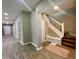 Inviting entryway with wood flooring, and staircase leading to the upper level at 3835 N Kenwood Ave, Indianapolis, IN 46208