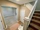 Inviting entryway featuring hardwood floors, staircase, and neutral paint, creating a warm welcome at 3835 N Kenwood Ave, Indianapolis, IN 46208