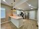 Beautiful kitchen with stainless steel appliances, counter seating and modern pendant lighting at 3835 N Kenwood Ave, Indianapolis, IN 46208