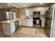 Updated kitchen featuring stainless steel appliances, quartz countertops, and ample cabinet space at 3835 N Kenwood Ave, Indianapolis, IN 46208