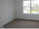 This bedroom features neutral walls, carpet, and a large window for natural light at 3993 Bozeman Way, Bargersville, IN 46106
