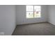 This bedroom features neutral walls, carpet, and a large window for natural light at 3993 Bozeman Way, Bargersville, IN 46106