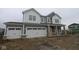 Charming two-story home showcasing a two-car garage and craftsman-style architecture with gray and white color palette at 3993 Bozeman Way, Bargersville, IN 46106