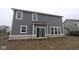 The exterior of the home includes gray siding and a sliding glass door at 3993 Bozeman Way, Bargersville, IN 46106