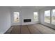 Bright living room with recessed lighting, a modern fireplace, and large windows offering plenty of natural light at 3993 Bozeman Way, Bargersville, IN 46106