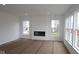 Bright living room with recessed lighting, a modern fireplace, and large windows offering plenty of natural light at 3993 Bozeman Way, Bargersville, IN 46106