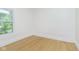 Bright bedroom with hardwood floors, a large window, and plenty of natural light at 4226 Cornelius Ave, Indianapolis, IN 46208